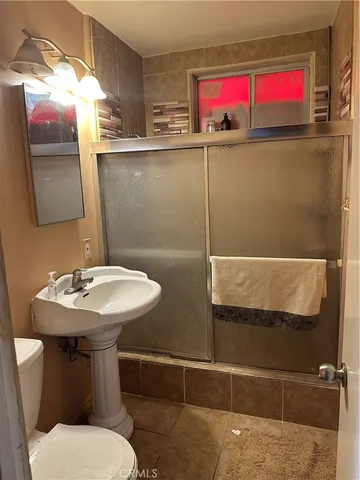 a bathroom with a sink and mirror