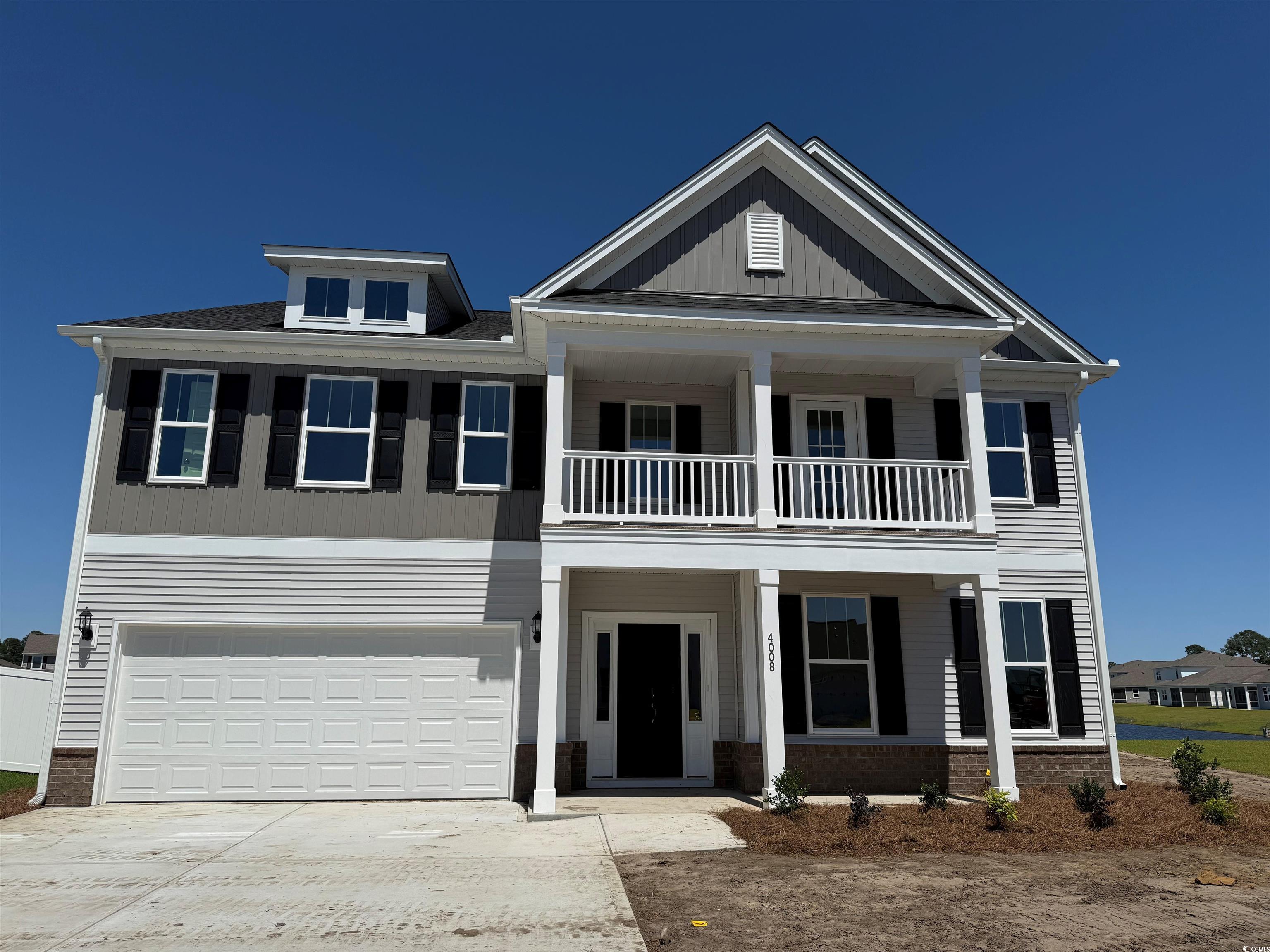 4008 Bucolic Loop Myrtle Beach, SC 29588 - Photo 1 of 39 View of front of home with a balcony, covered porc