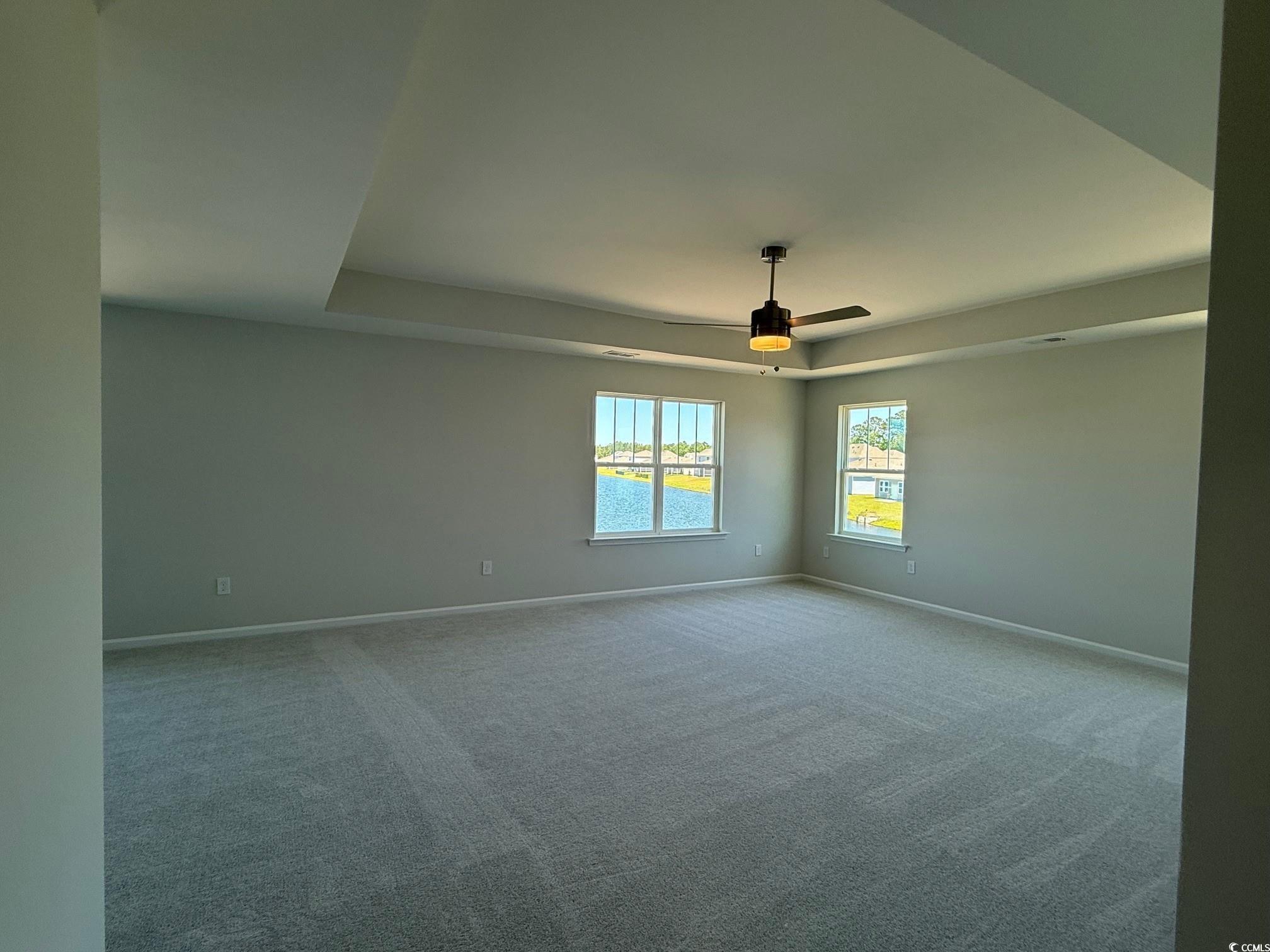 4008 Bucolic Loop Myrtle Beach, SC 29588 - Photo 11 of 39 Unfurnished room with a raised ceiling, baseboards