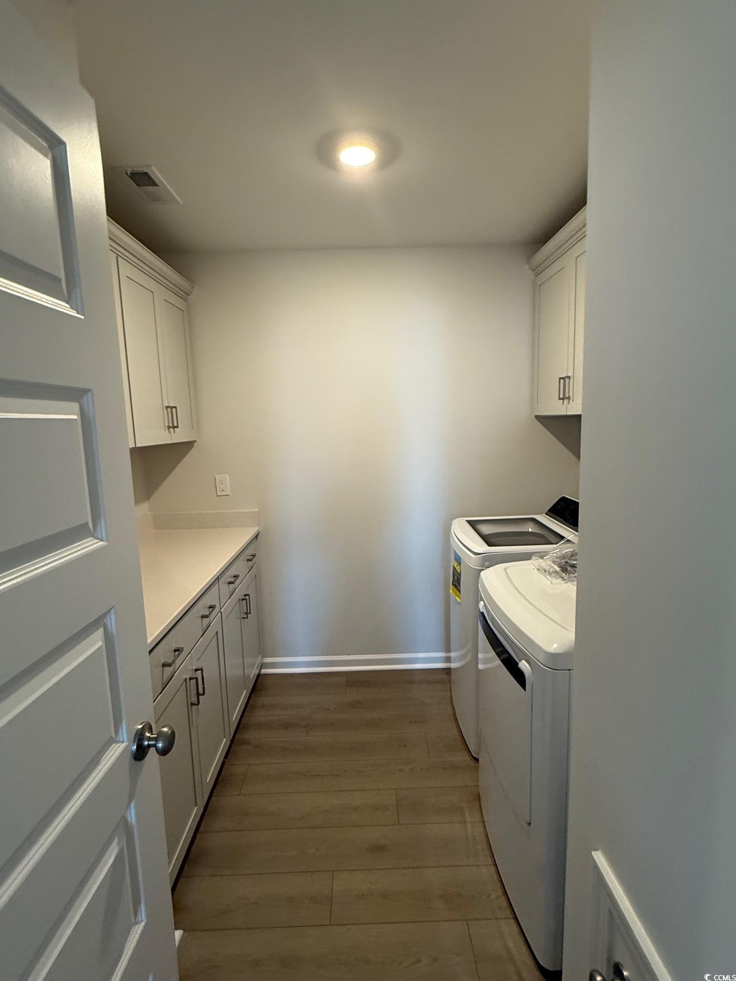 4008 Bucolic Loop Myrtle Beach, SC 29588 - Photo 12 of 39 Laundry room with cabinet space, washer and dryer,
