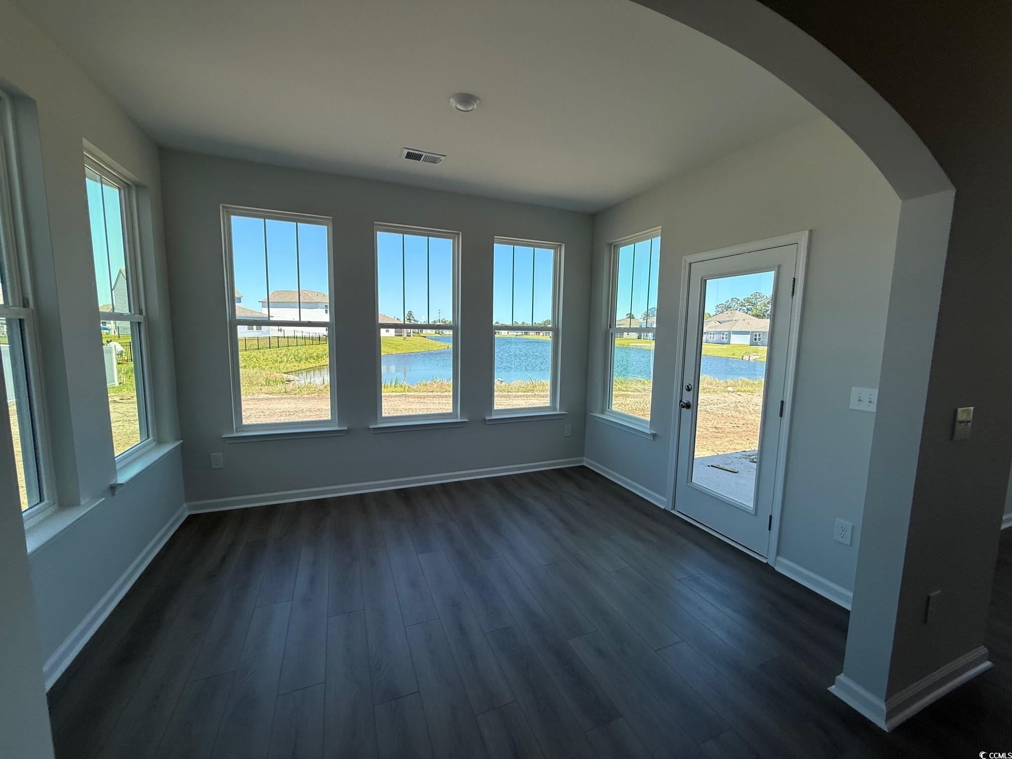 4008 Bucolic Loop Myrtle Beach, SC 29588 - Photo 7 of 39 Unfurnished sunroom featuring arched walkways and