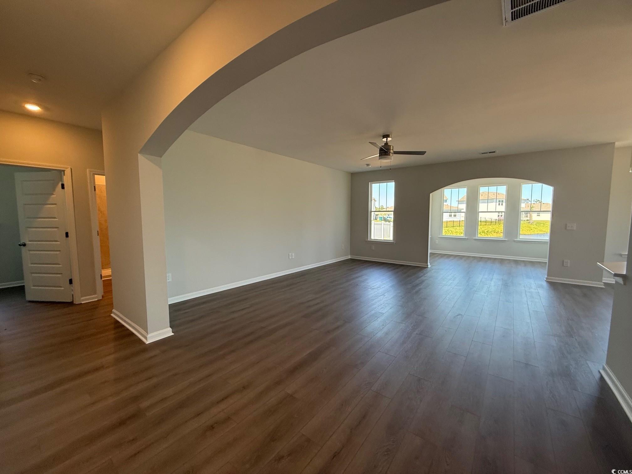 4008 Bucolic Loop Myrtle Beach, SC 29588 - Photo 8 of 39 Unfurnished living room with a ceiling fan, arched
