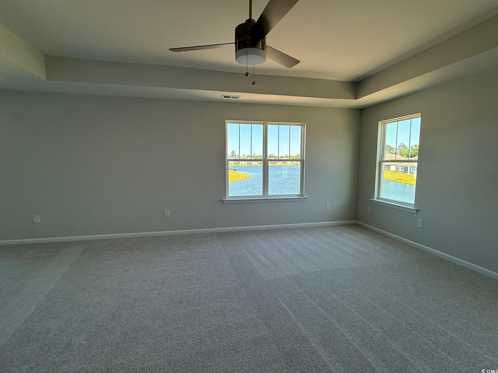4008 Bucolic Loop Myrtle Beach, SC 29588 - Photo 10 of 39 Empty room featuring baseboards, ceiling fan, carp