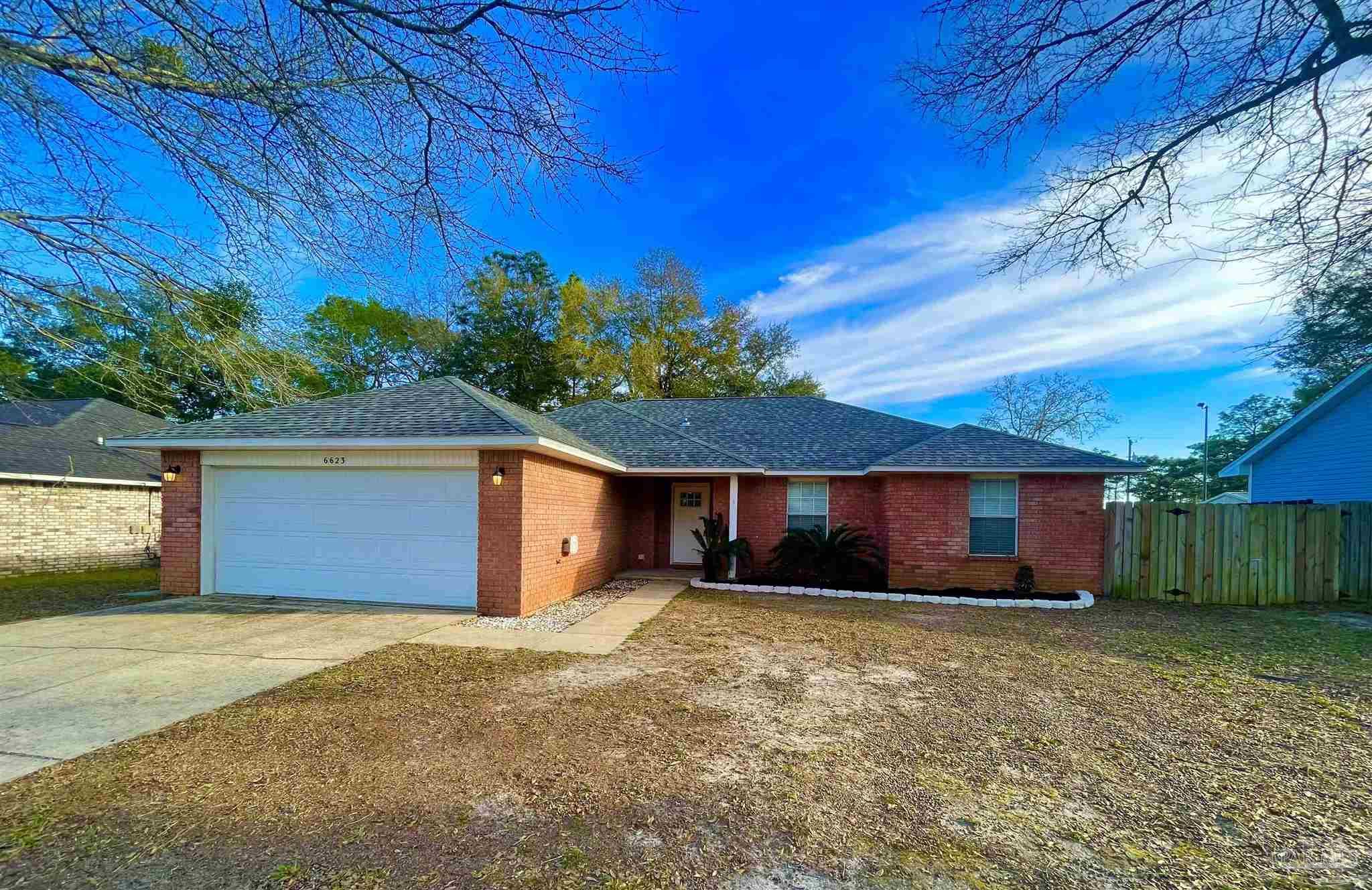 6623 Ridge Crest Drive Milton, FL 32570 - Photo 1 of 24 front view of a house with a yard