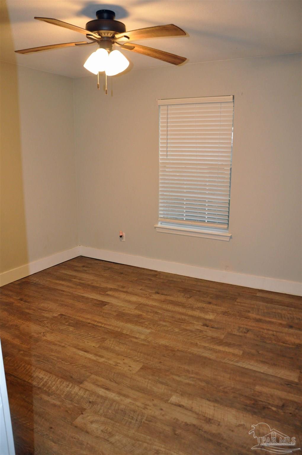 6623 Ridge Crest Drive Milton, FL 32570 - Photo 17 of 24 wooden floor in an empty room