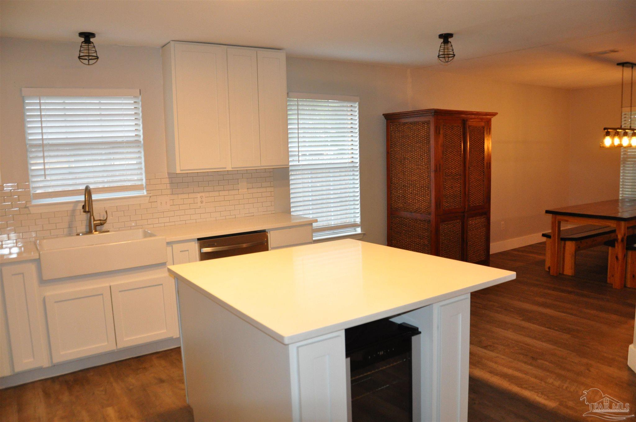 6623 Ridge Crest Drive Milton, FL 32570 - Photo 10 of 24 a kitchen that has a sink and a stove