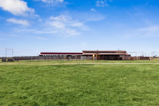 a big house with a big yard and large trees