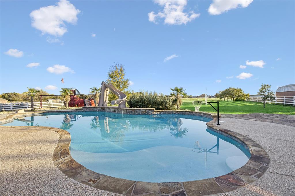 Tbd Mitchell Road Krum, TX 76249 - Photo 20 of 39 a view of a swimming pool with a table and chairs