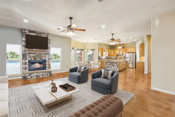 a kitchen with stainless steel appliances granite countertop a stove and refrigerator