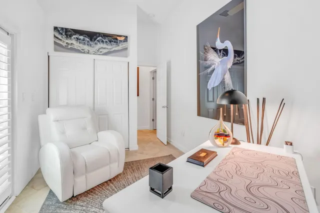 a bedroom with furniture and a book shelf