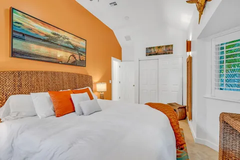 a bedroom with bed and window