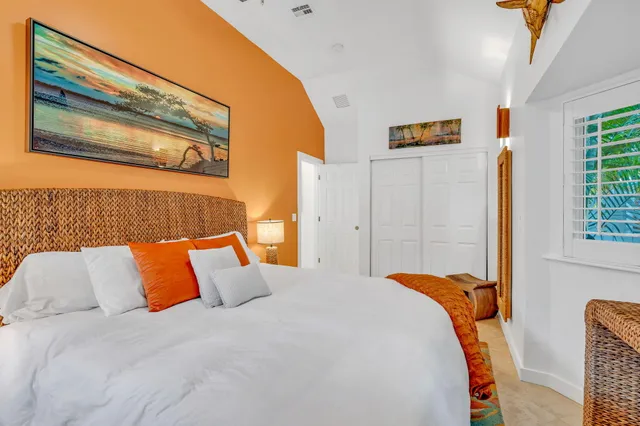 a bedroom with bed and window