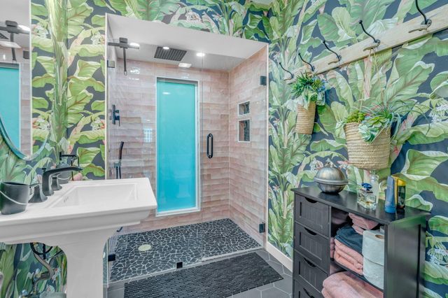 a white toilet sitting next to a bathroom sink