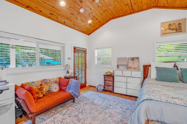 a bedroom with bed and window