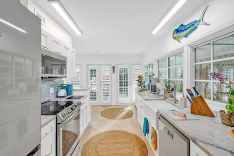 a very nice looking dining room with a large window