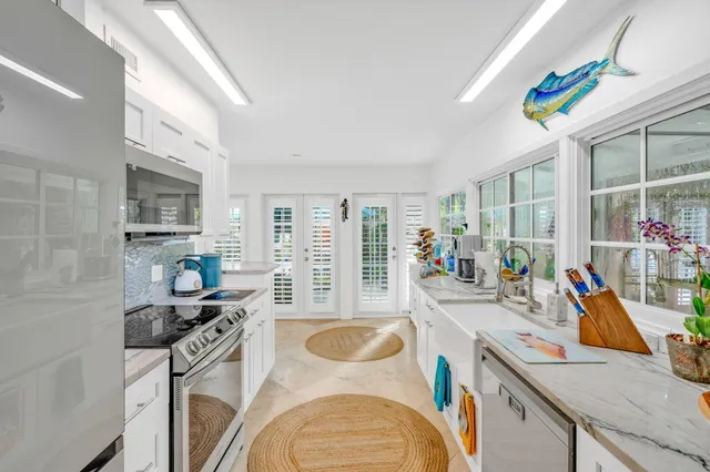 a very nice looking dining room with a large window