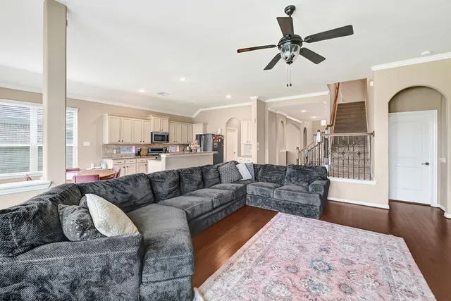 a living room with furniture and a large window