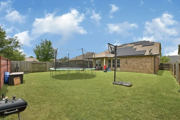 a view of a garden with a slide