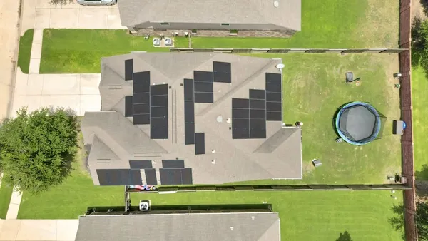 a aerial view of a house with a garden and plants