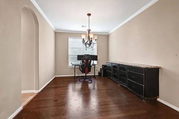 a view of a room with furniture window and wooden floor