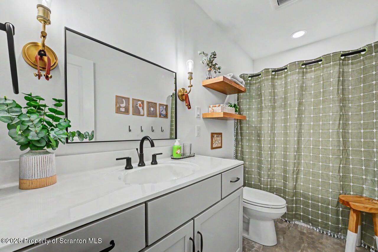 100 Highland Road Moscow, PA 18444 - Photo 63 of 85 a bathroom with a sink a toilet and shower