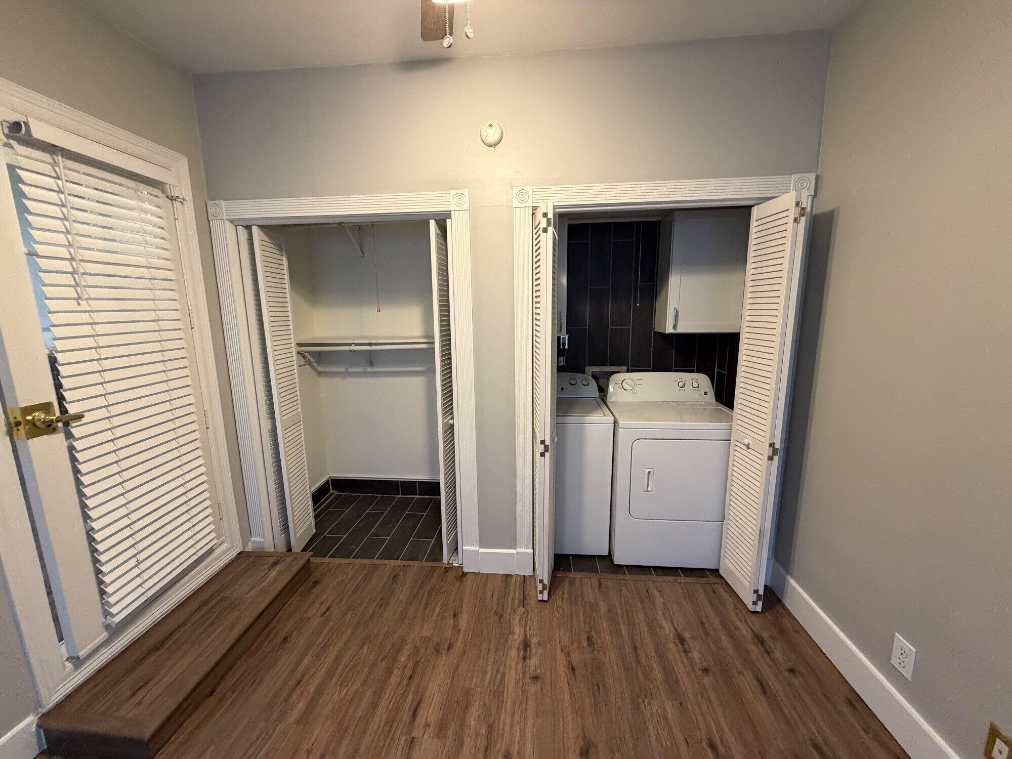 2703 30th Street Lubbock, TX 79410 - Photo 8 of 15 a view of utility room with closet and wooden floor
