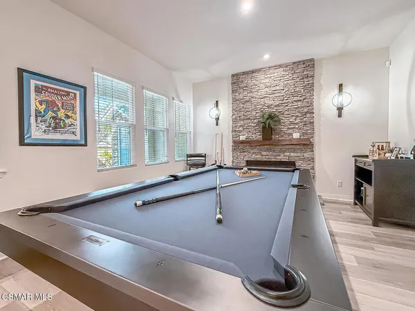 a kitchen with stainless steel appliances granite countertop a stove and a microwave