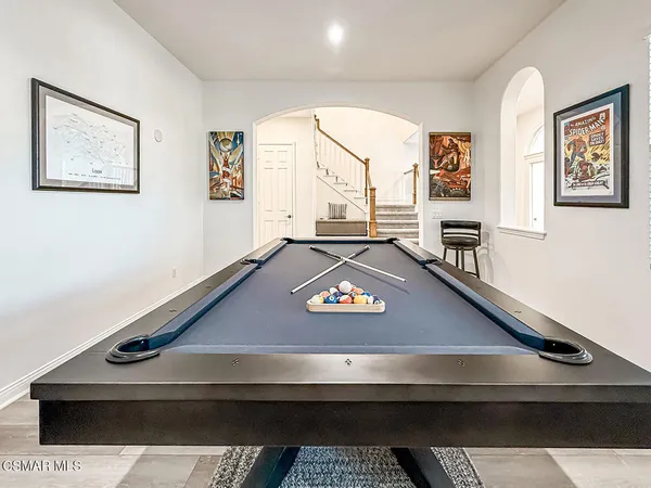 a kitchen with stainless steel appliances granite countertop sink stove and wooden floor
