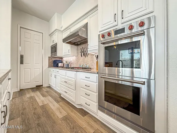 a view of a livingroom with furniture and stairs