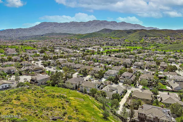 an aerial view of residential house and green space