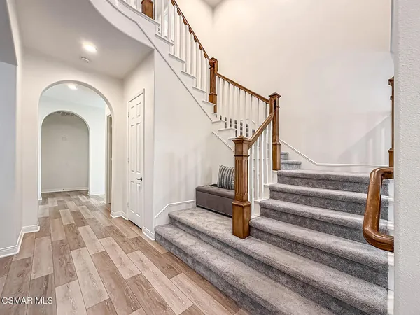 a bathroom with a shower a toilet and a window