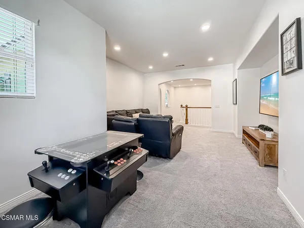a large bathroom with a double vanity sink a mirror and a bathtub