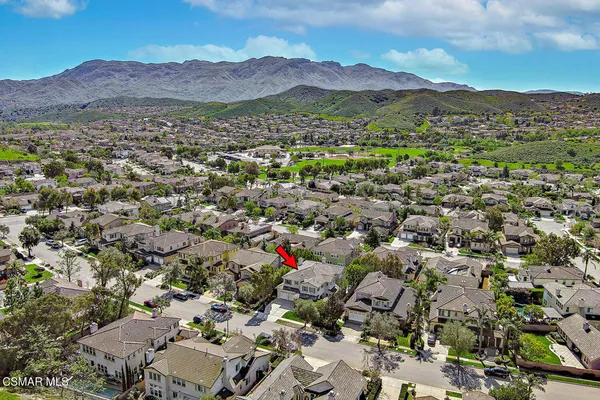 an aerial view of a house with a yard