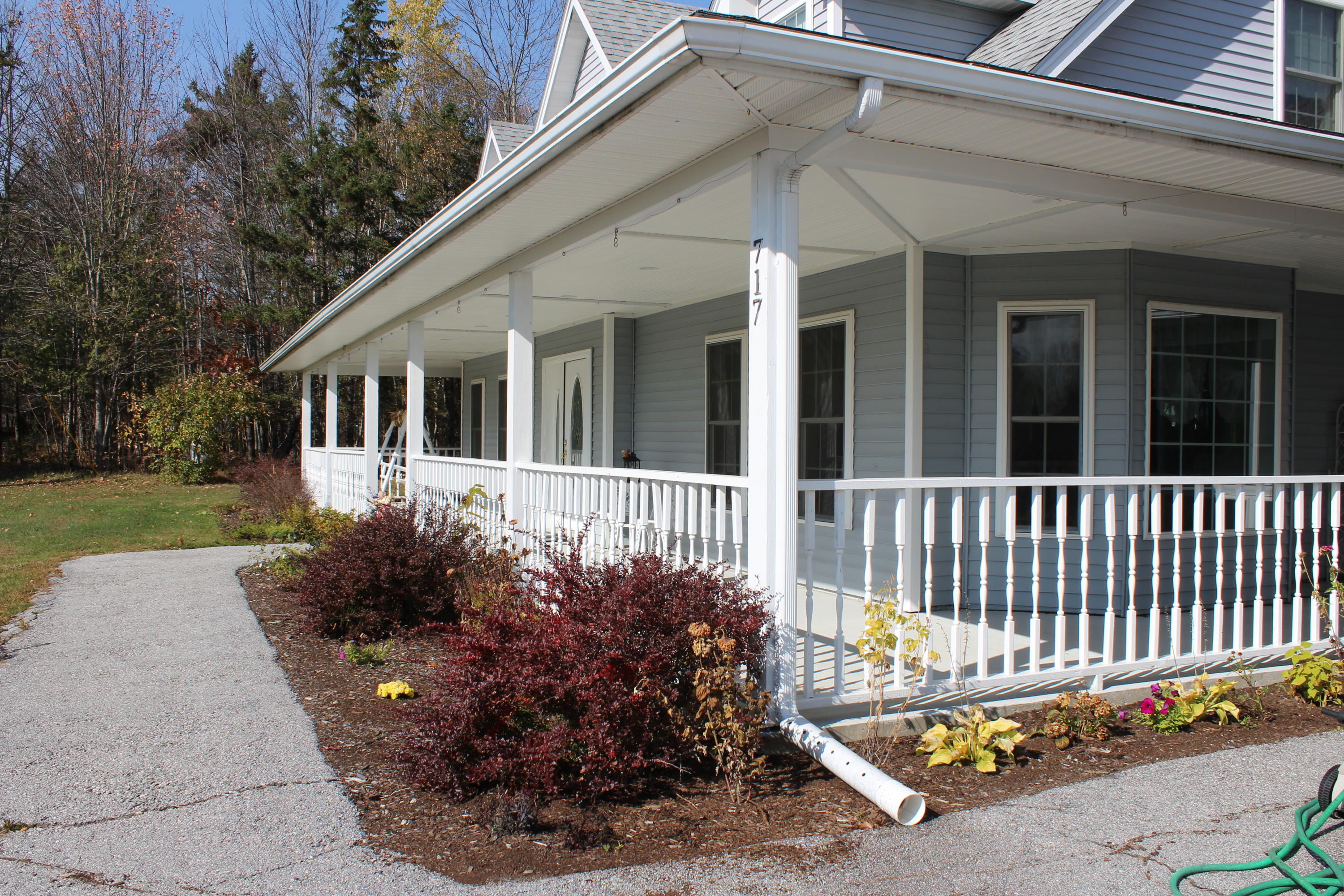 717 Tate Road Corinth, ME 04427 - Photo 45 of 57 perennial garden along front porch