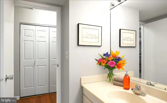 a bathroom with a sink a vanity and a mirror