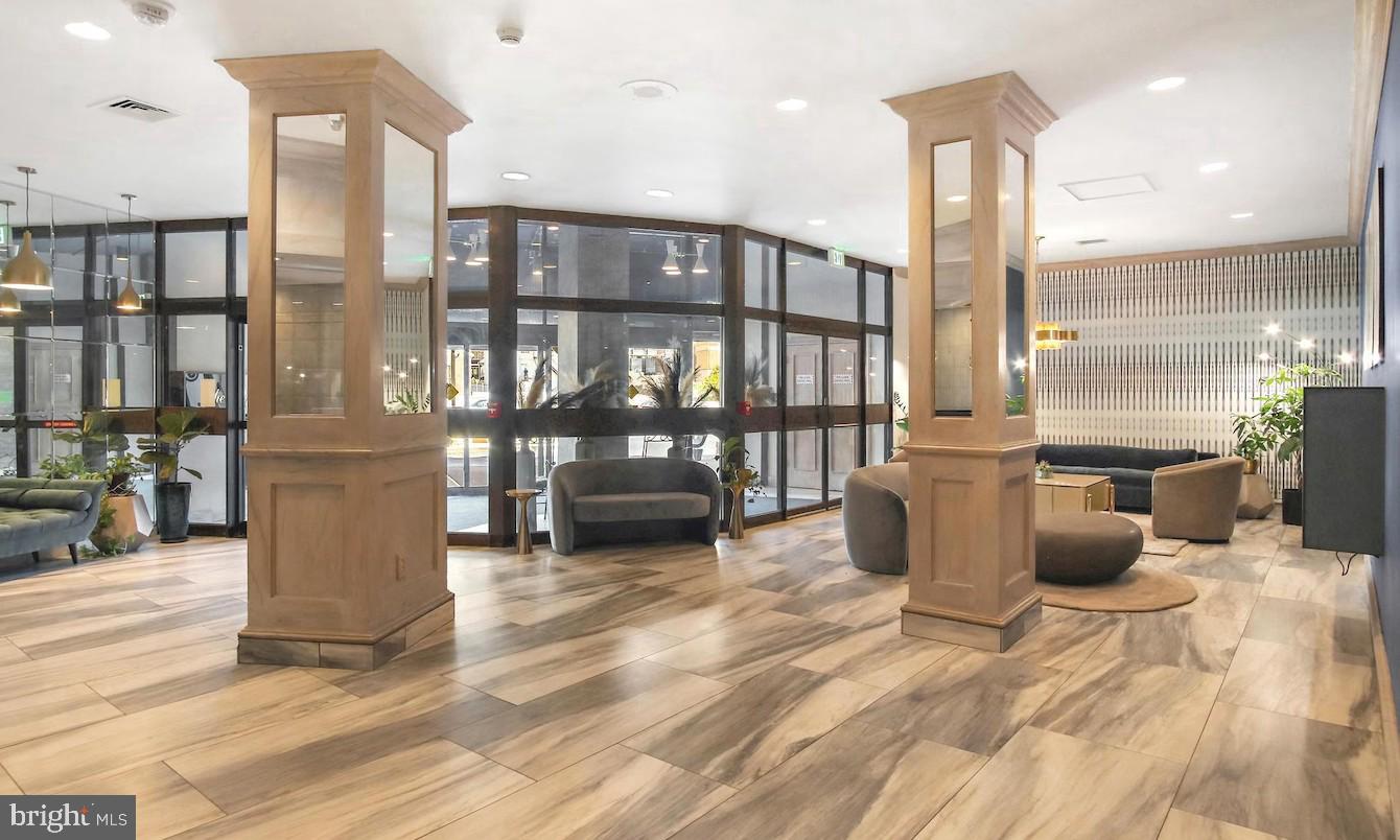 205 East Joppa Road, Unit 608 Towson, MD 21286 - Photo 16 of 26 a view of a kitchen with kitchen island dining table and chairs