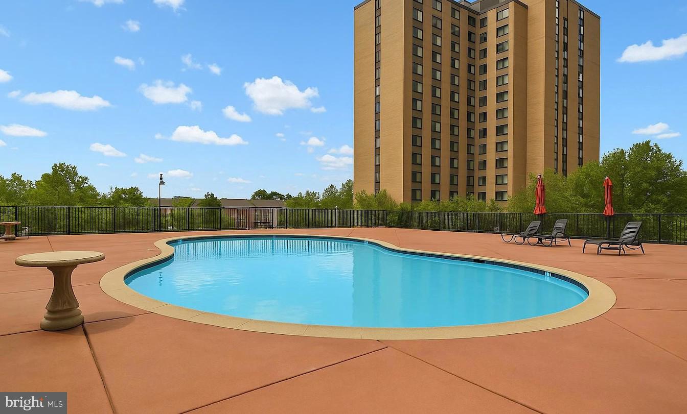 205 East Joppa Road, Unit 608 Towson, MD 21286 - Photo 20 of 26 a view of a swimming pool with a yard