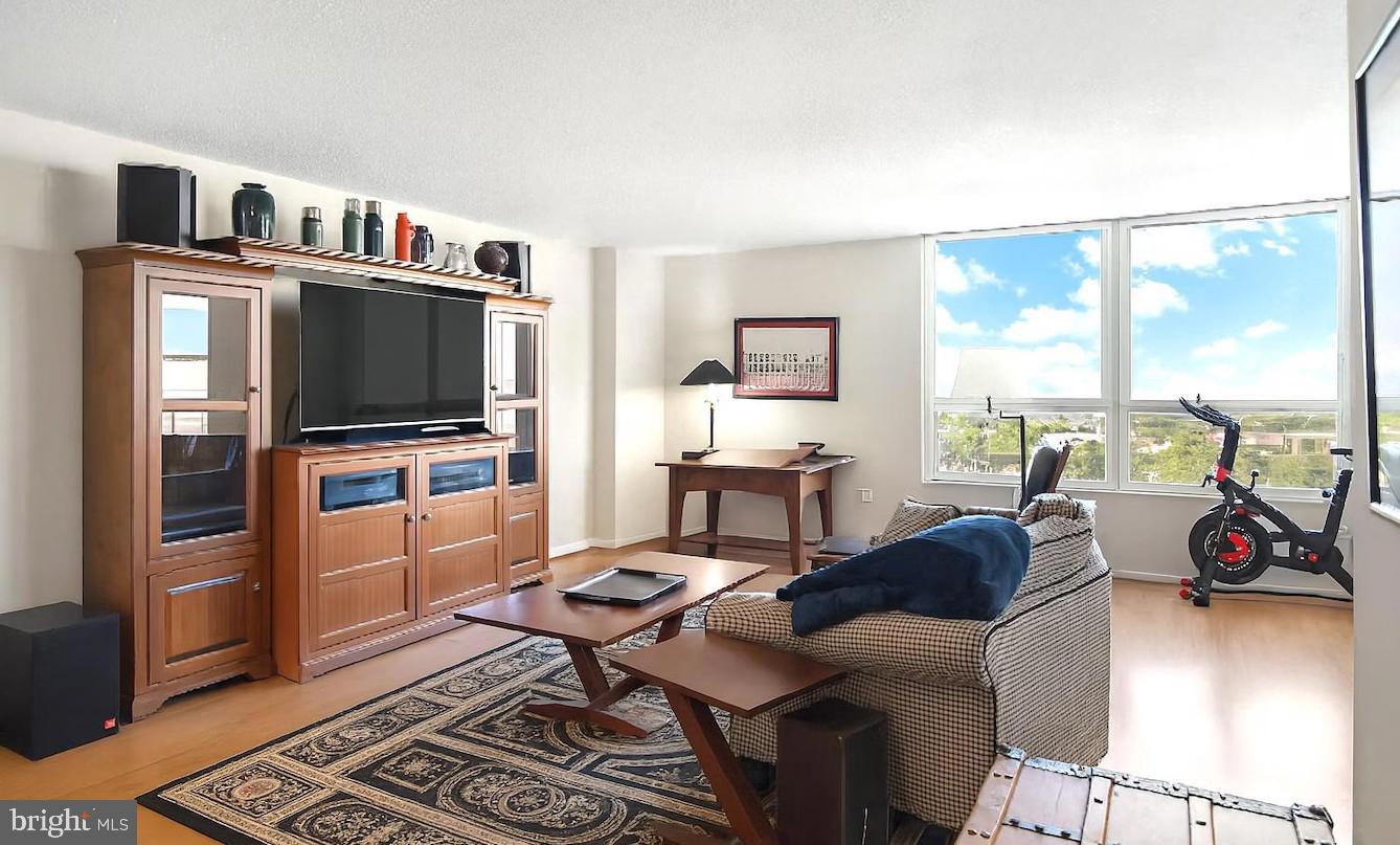 205 East Joppa Road, Unit 608 Towson, MD 21286 - Photo 2 of 26 a living room with furniture and a flat screen tv