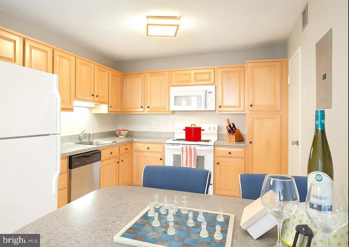 205 East Joppa Road, Unit 608 Towson, MD 21286 - Photo 5 of 26 a kitchen with stainless steel appliances granite countertop a refrigerator sink and cabinets