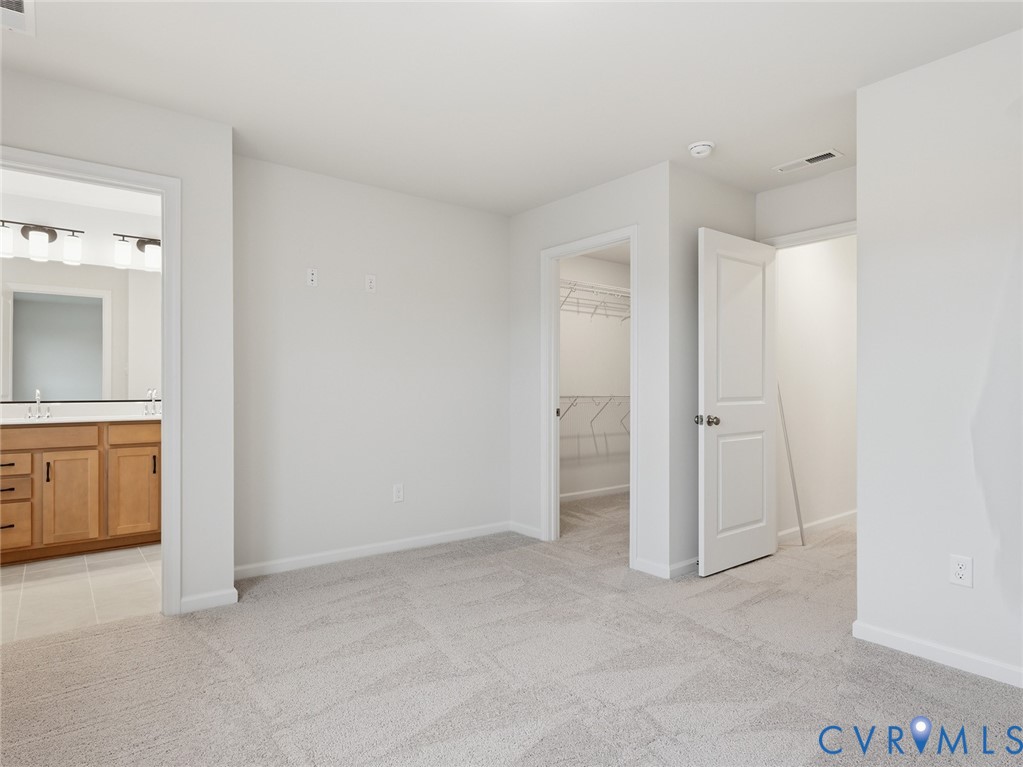 157 Corcoran Way Aylett, VA 23009 - Photo 12 of 22 an empty room with a bathroom