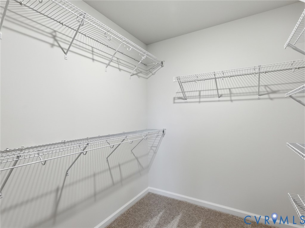 157 Corcoran Way Aylett, VA 23009 - Photo 14 of 22 a view of a room with racks on the wall