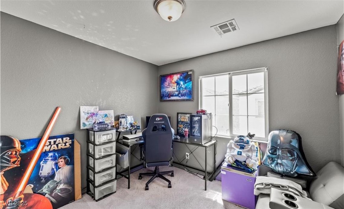 7708 Custom Weave Court Las Vegas, NV 89149 - Photo 17 of 32 Office area with a textured wall and carpet floors