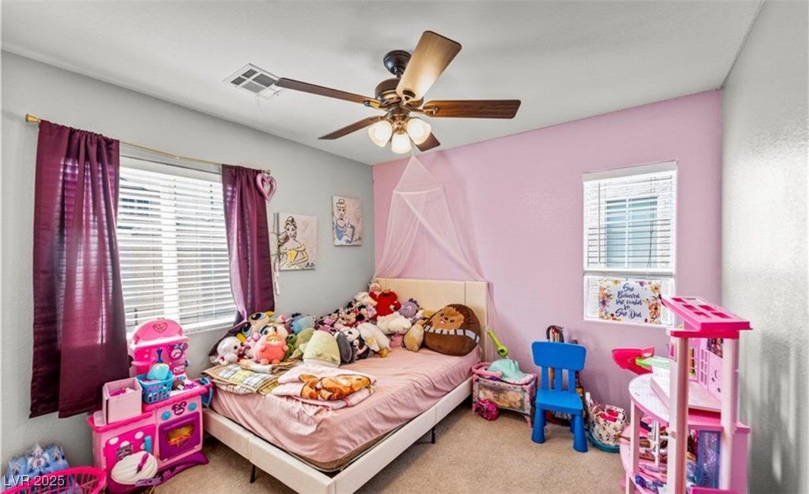 7708 Custom Weave Court Las Vegas, NV 89149 - Photo 19 of 32 Bedroom with light carpet and a ceiling fan