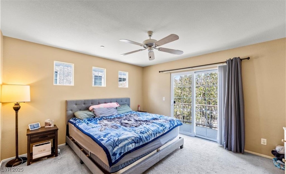 7708 Custom Weave Court Las Vegas, NV 89149 - Photo 22 of 32 Carpeted bedroom with ceiling fan and access to outside