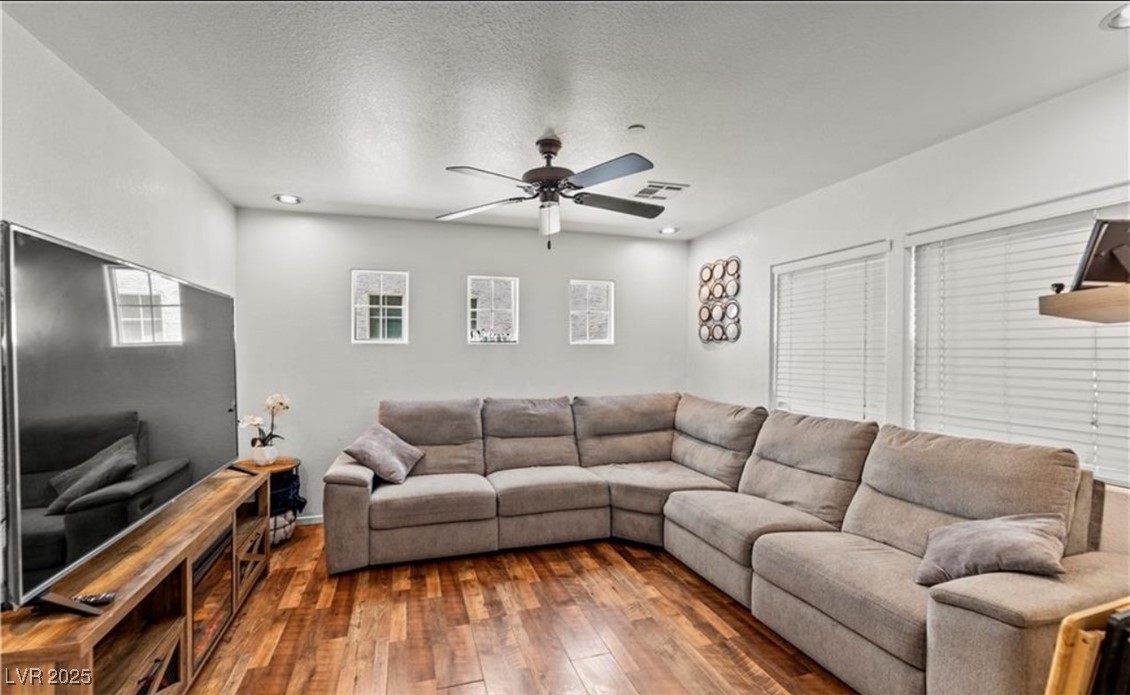7708 Custom Weave Court Las Vegas, NV 89149 - Photo 4 of 32 Living room featuring hardwood / wood-style flooring, a ceiling fan, a textured ceiling, and recessed lighting