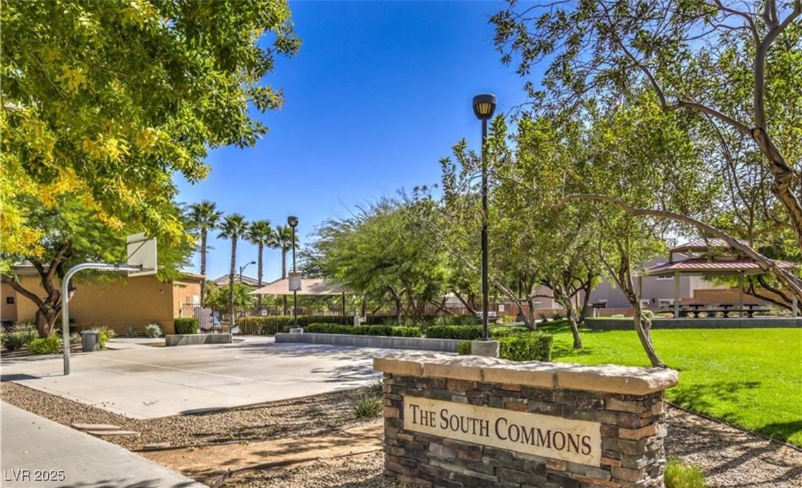 7708 Custom Weave Court Las Vegas, NV 89149 - Photo 5 of 32 View of property's community featuring a lawn