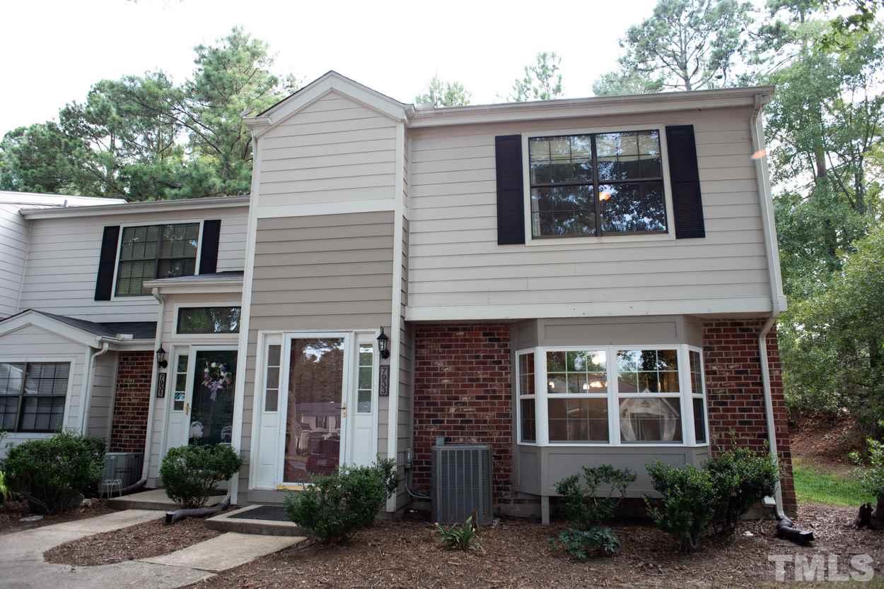 7933 Falcon Rest Circle, Unit 7933 Raleigh, NC 27615 - Photo 1 of 28 a view of a house with a yard and plants