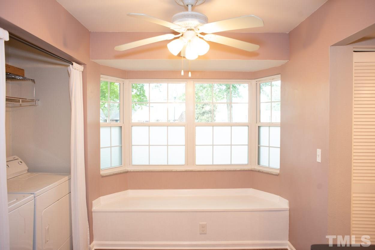 7933 Falcon Rest Circle, Unit 7933 Raleigh, NC 27615 - Photo 14 of 28 a bathroom with a bathtub and a shower