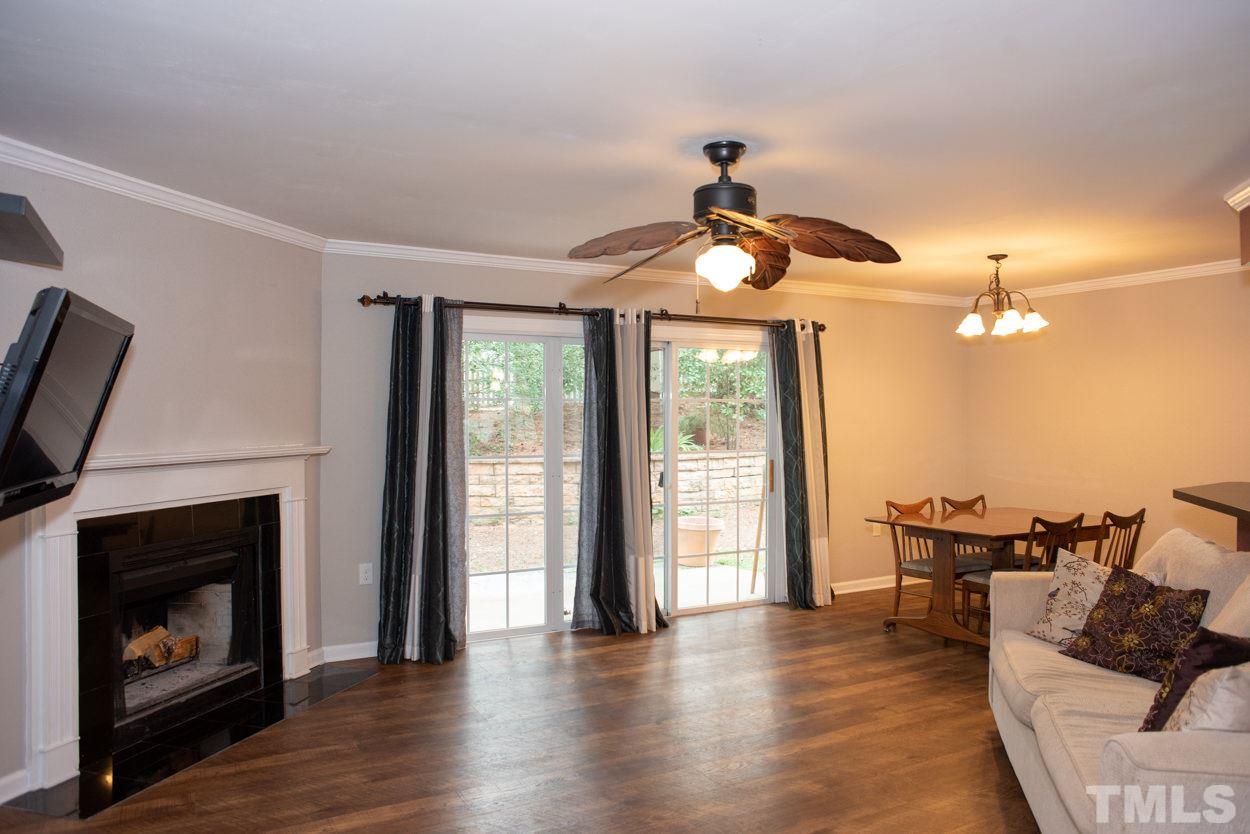 7933 Falcon Rest Circle, Unit 7933 Raleigh, NC 27615 - Photo 3 of 28 a view of a livingroom with furniture and a fireplace