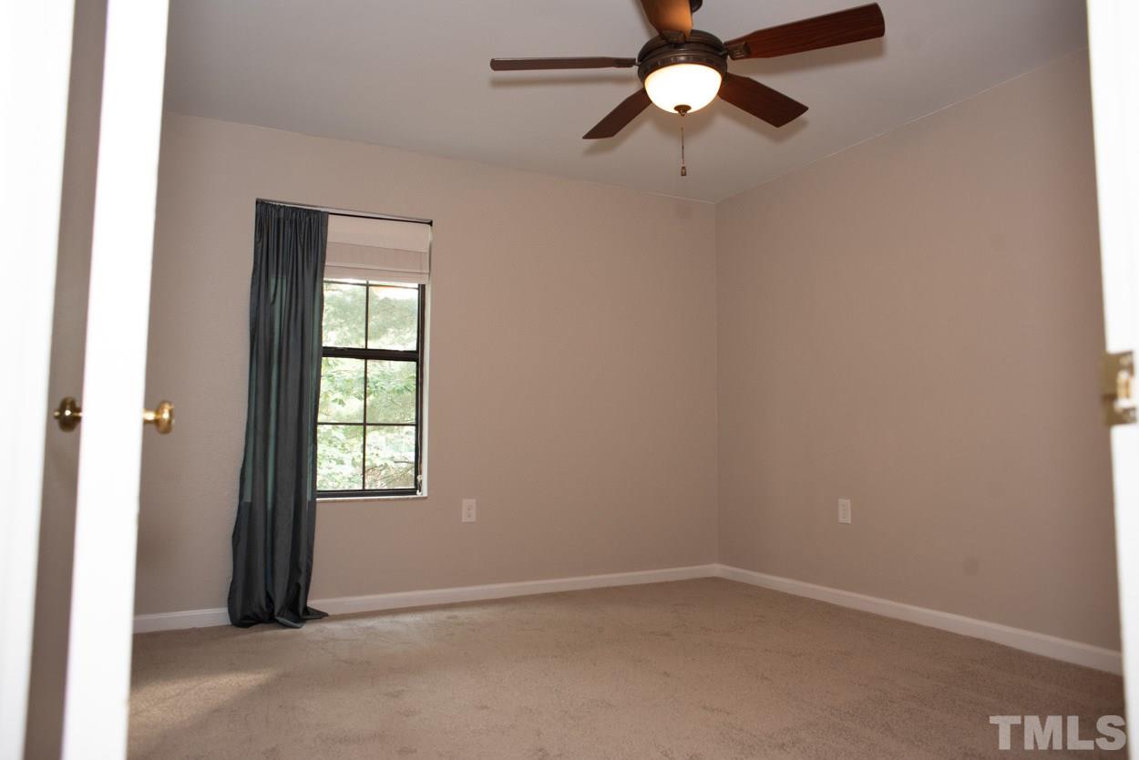 7933 Falcon Rest Circle, Unit 7933 Raleigh, NC 27615 - Photo 23 of 28 an empty room with closet and windows